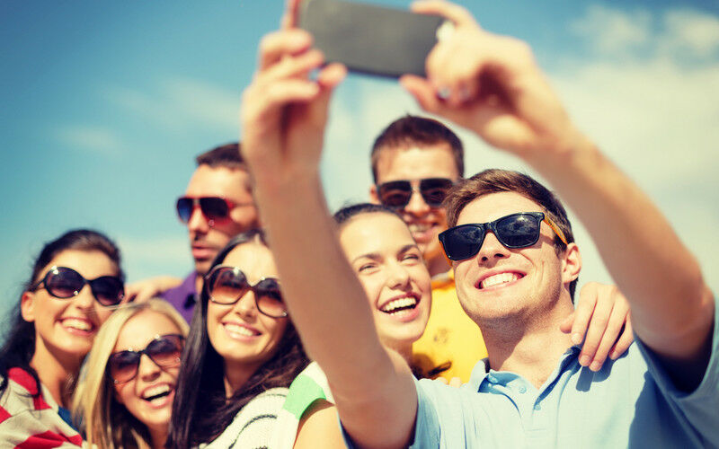 Group Of Smiling People Taking A Selfie 800x500